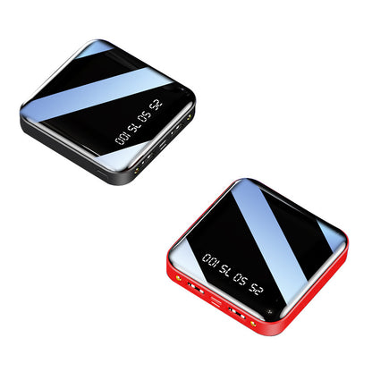 Pair of mini portable power banks (black and red) with mirrored tops and digital percentage displays.