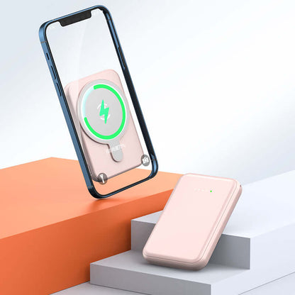 Mini Magnetic Power Bank 5000mAh Wireless charging with a smartphone on a stylish background.