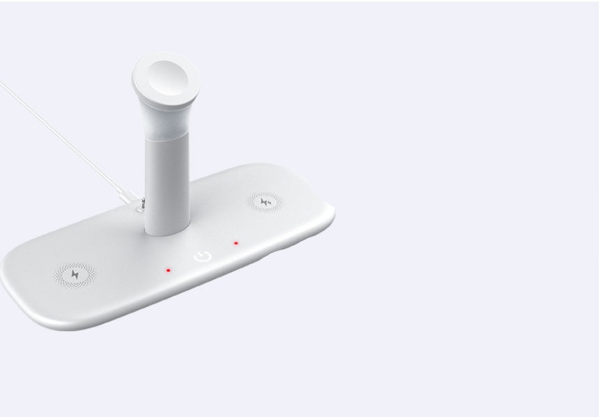 White wireless charging pad featuring a central watch stand, two flat charging spots, and red power indicator lights.