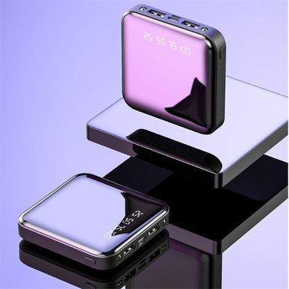 Two square, mini power banks featuring a reflective purple mirror finish and a digital battery percentage display.