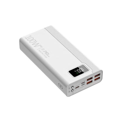 White, rectangular power bank (100W) with a digital battery display and four charging ports, angled view.