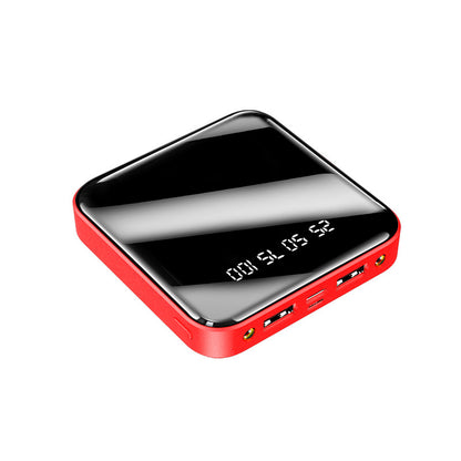 A compact, red power bank with a glossy black mirror display showing battery levels (25, 50, 75, 100) and multiple charging ports.